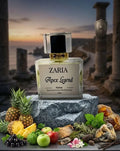 Zaria Apex Legend perfume bottle with fruits and herbs on a stone surface with a scenic background