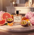 Zaria Femme Allure perfume bottle surrounded by fruits and flowers on a marble surface.
