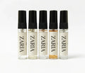 Five Zaria perfume bottles of different colors on a white background