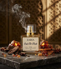 Zaria Oud Al-Arab perfume bottle with oud resins and spices on a dark surface.
