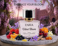 Zaria Velvet Bloom perfume bottle with fruits and flowers on a decorative stand with a blurred floral background.